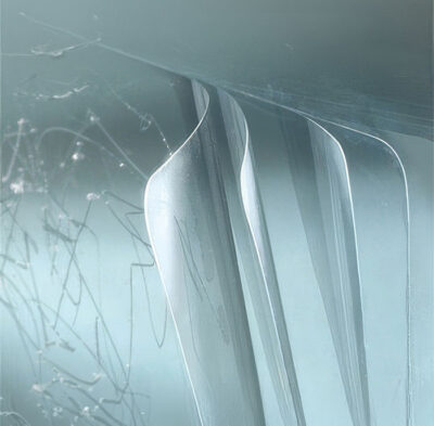 Multi-layer protective film tear offs installed on glass and equipment surfaces across industrial environments