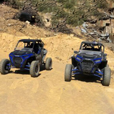 Polaris RZR 1000 side by side equipped with protective peel-away film on polycarbonate half windshield