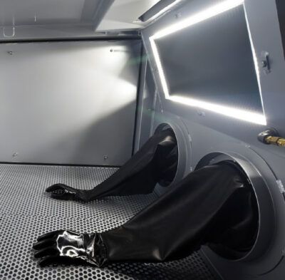 Industrial containment glove box viewport protected by TearOff multi-layer sacrificial film for clear operator sightlines
